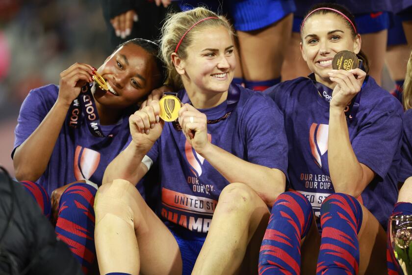 San Diego CA - March 10: United States' Jaedyn Shaw, left, Lindsey Horan and Alex Morgan celebrate after beating Brazil 1-0 in the Concacaf W Gold Cup final at Snapdragon Stadium on Sunday, March 10, 2024 in San Diego, CA. (K.C. Alfred / The San Diego Union-Tribune)