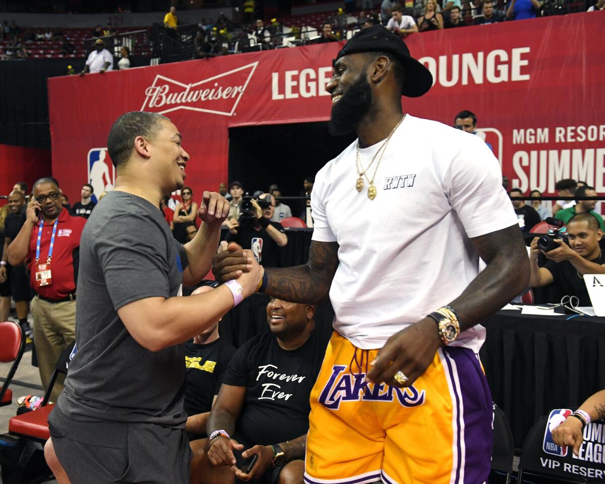 Head coach Tyronn Lue (L) of the Cleveland Cavaliers greets LeBron James of the Los Angeles Lakers after a quarterfinal game of the 2018 NBA Summer League between the Lakers and the Detroit Pistons at the Thomas & Mack Center on July 15, 2018 in Las Vegas, Nevada.