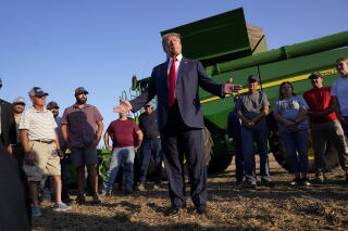 FILE - Former President Donald Trump speaks to reporters during a visit to the