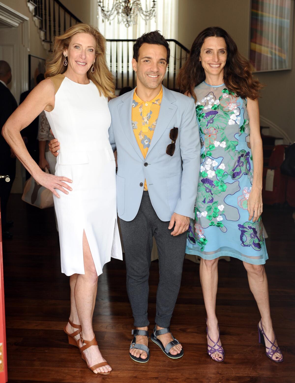 Janet Crown, left, George Kotsiopoulos and Elizabeth Stewart hosted the annual P.S. Arts Bag Lunch.