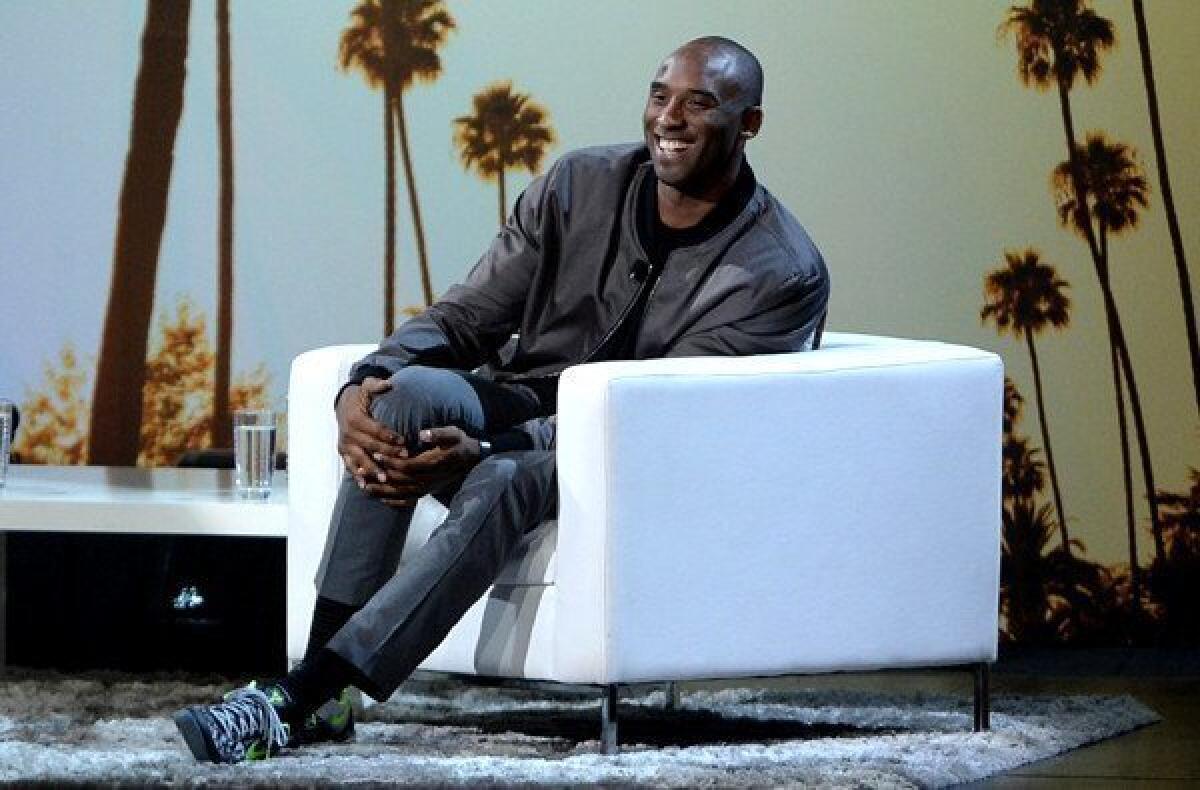 Lakers All-Star guard Kobe Bryant shares a laugh with the audience during "Kobe Up Close Hosted by Jimmy Kimmel" on Thursday night at the Nokia Theatre.