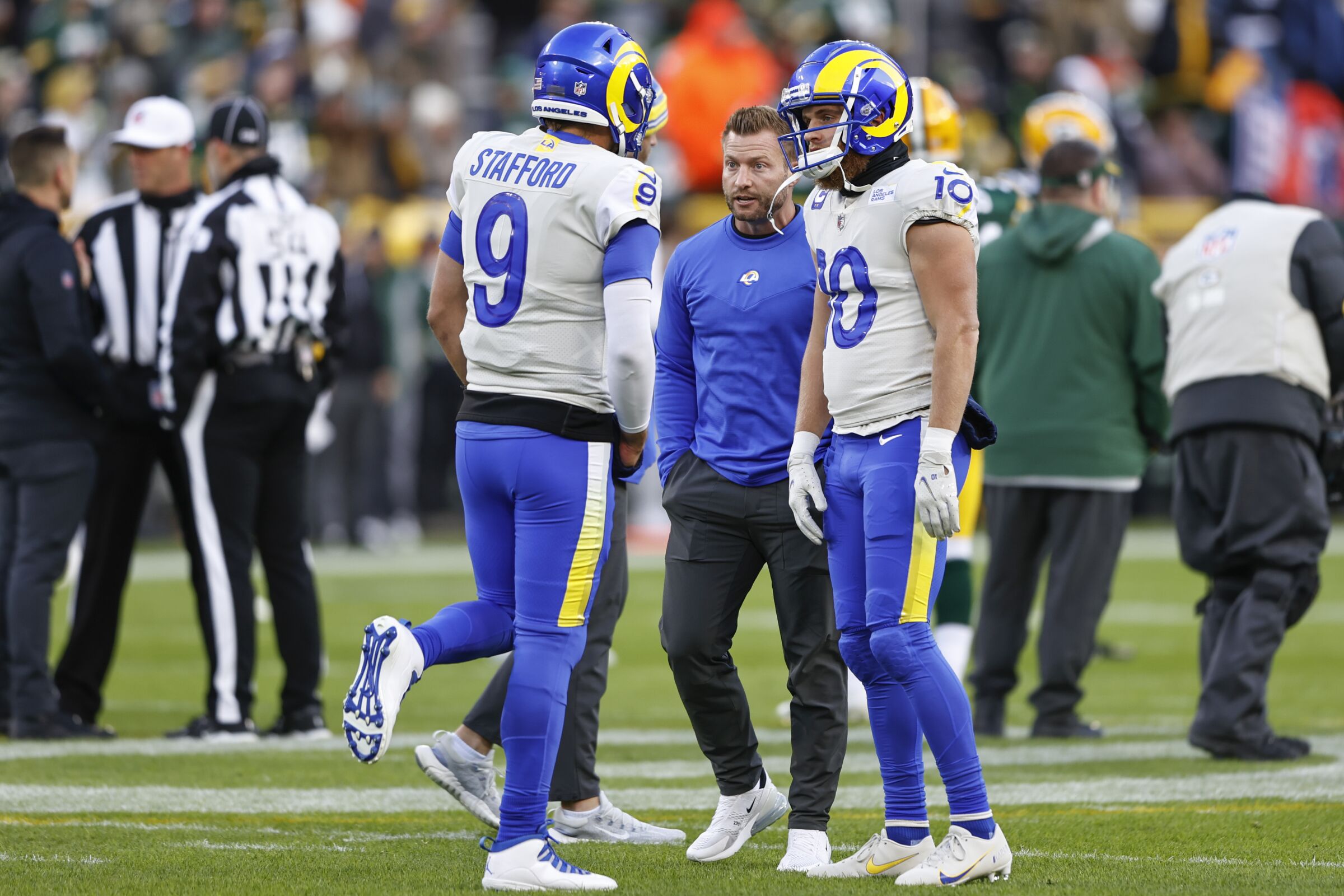 Rams coach Sean McVay talks with quarterback Matthew Stafford and receiver Cooper Kupp before a game
