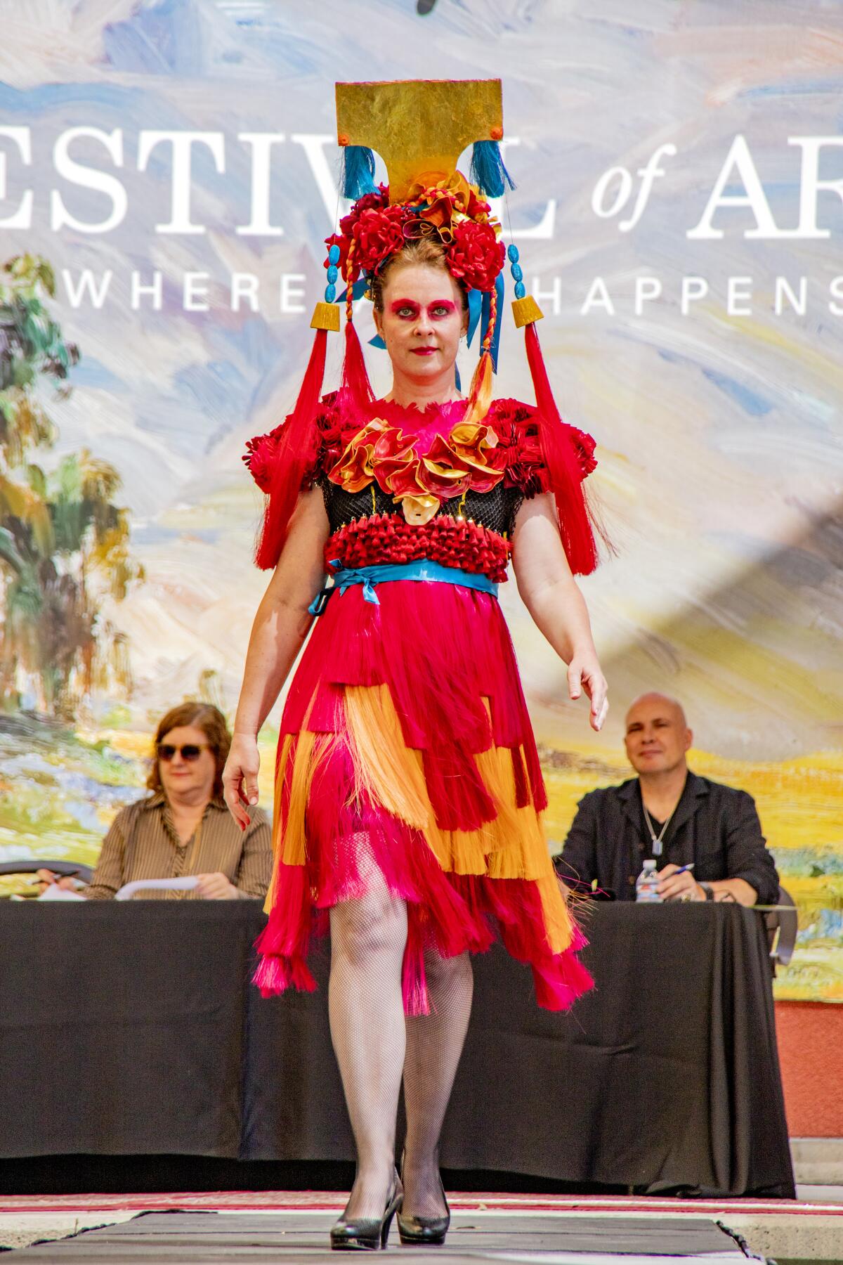 Natasha Nelson models Mariana Nelson's outfit made from ribbons at the 2019 Festival of Arts fashion show.
