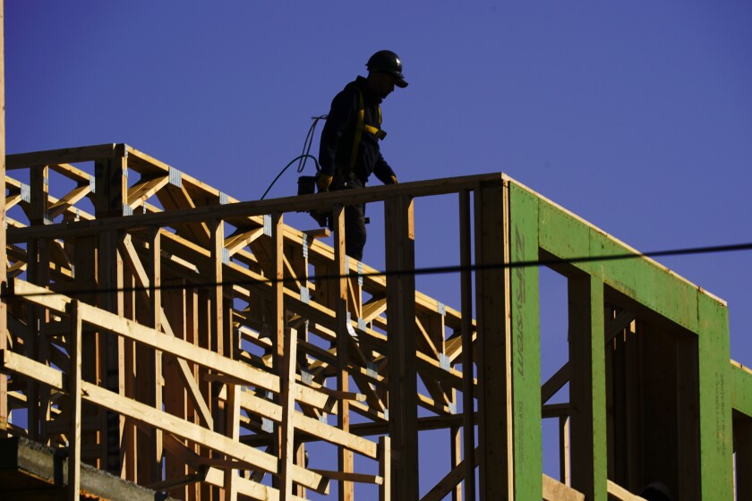 New home construction in Philadelphia, Pa., Wednesday, Nov. 17, 2021. U.S. homebuilder stocks have outpaced the broader market this year, and analysts are bullish on the prospects for more gains in 2022, despite expectations of continued supply chain woes.(AP Photo/Matt Rourke)