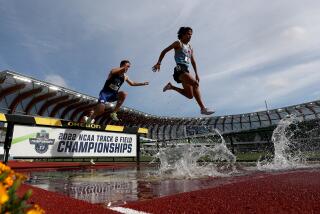 Estanis Ruiz of Loyola Marymount soars in the air as he competes in the 3,000 meter steeplechase semifinal