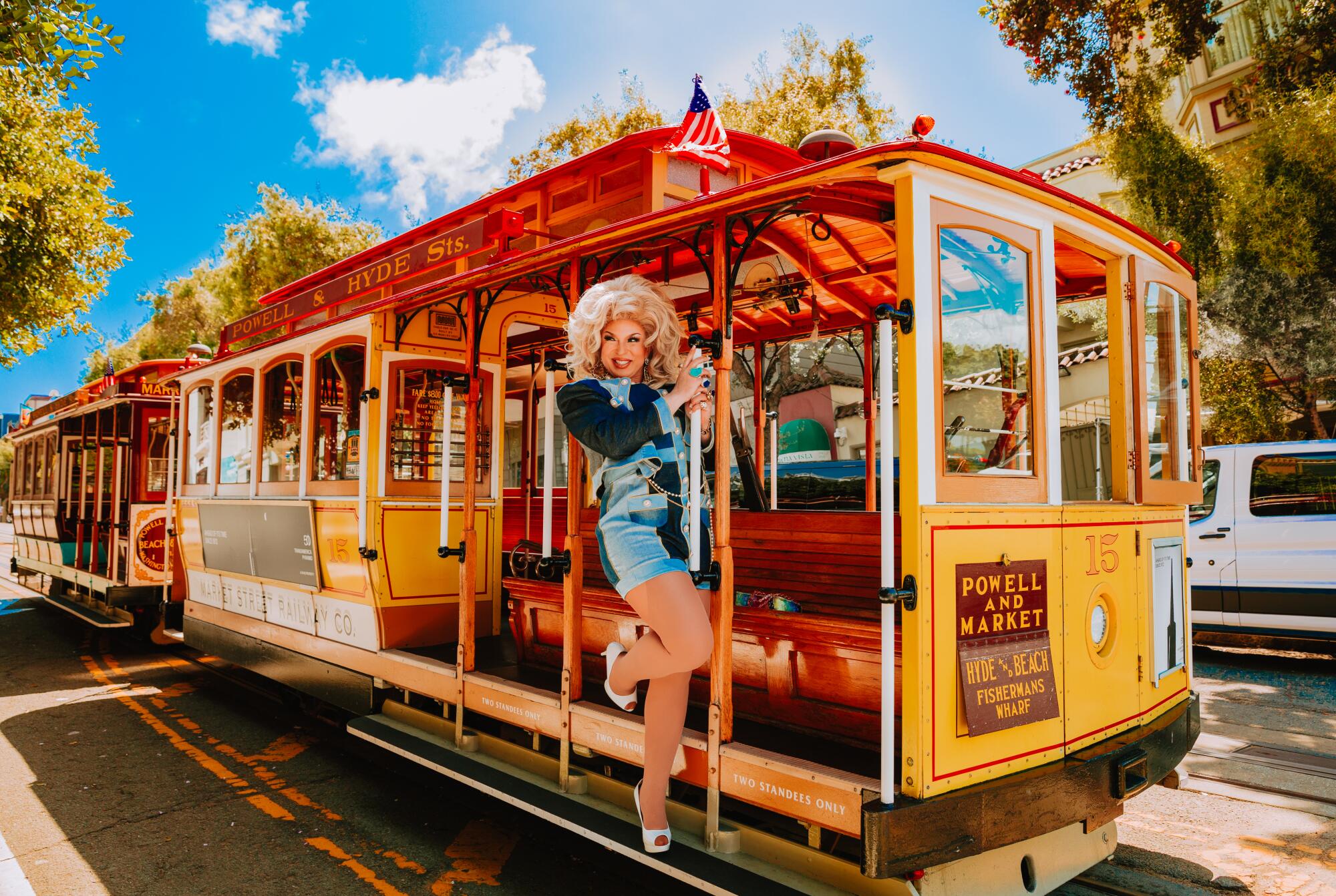 A drag performer on a San Francisco trolley.