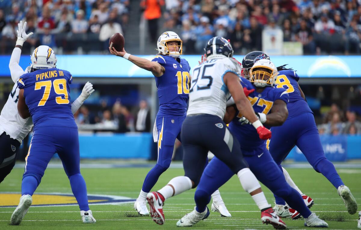 Chargers quarterback Justin Herbert passes against the Titans in the first half Sunday.
