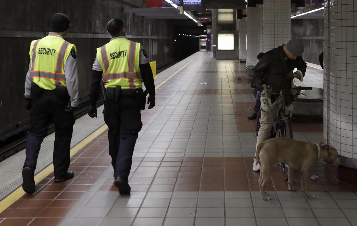 Security officers patrol the MacArthur station in L.A.