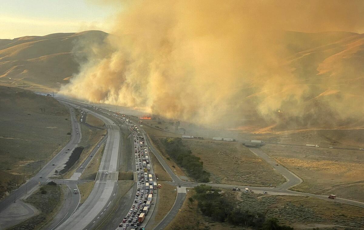 The Tumbleweed fire burns along the 5 Freeway on July 4.