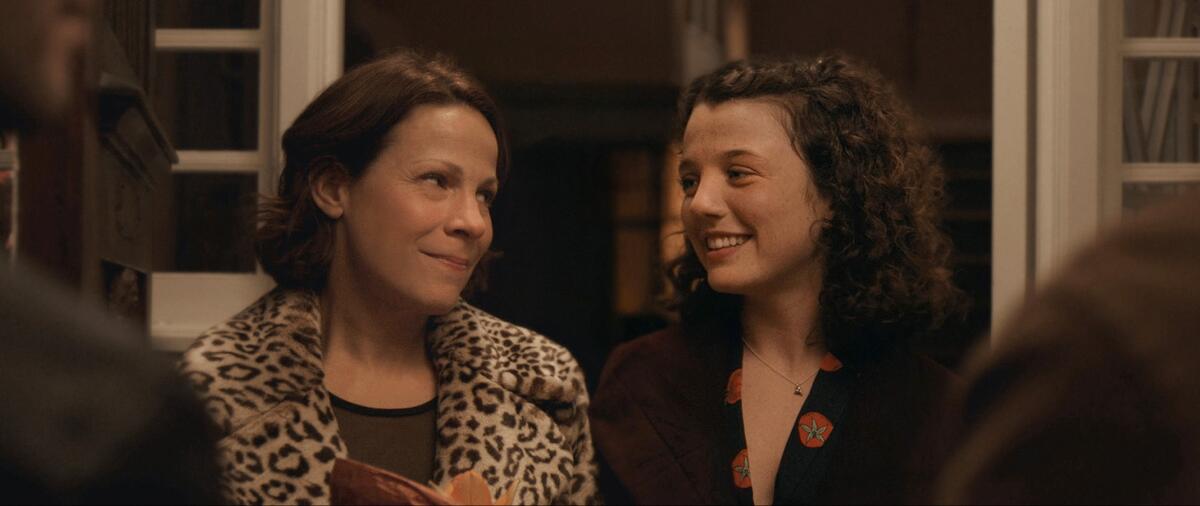 Lili Taylor, left, and Stefania LaVie Owen look lovingly at each other in a scene from the movie "Paper Spiders."