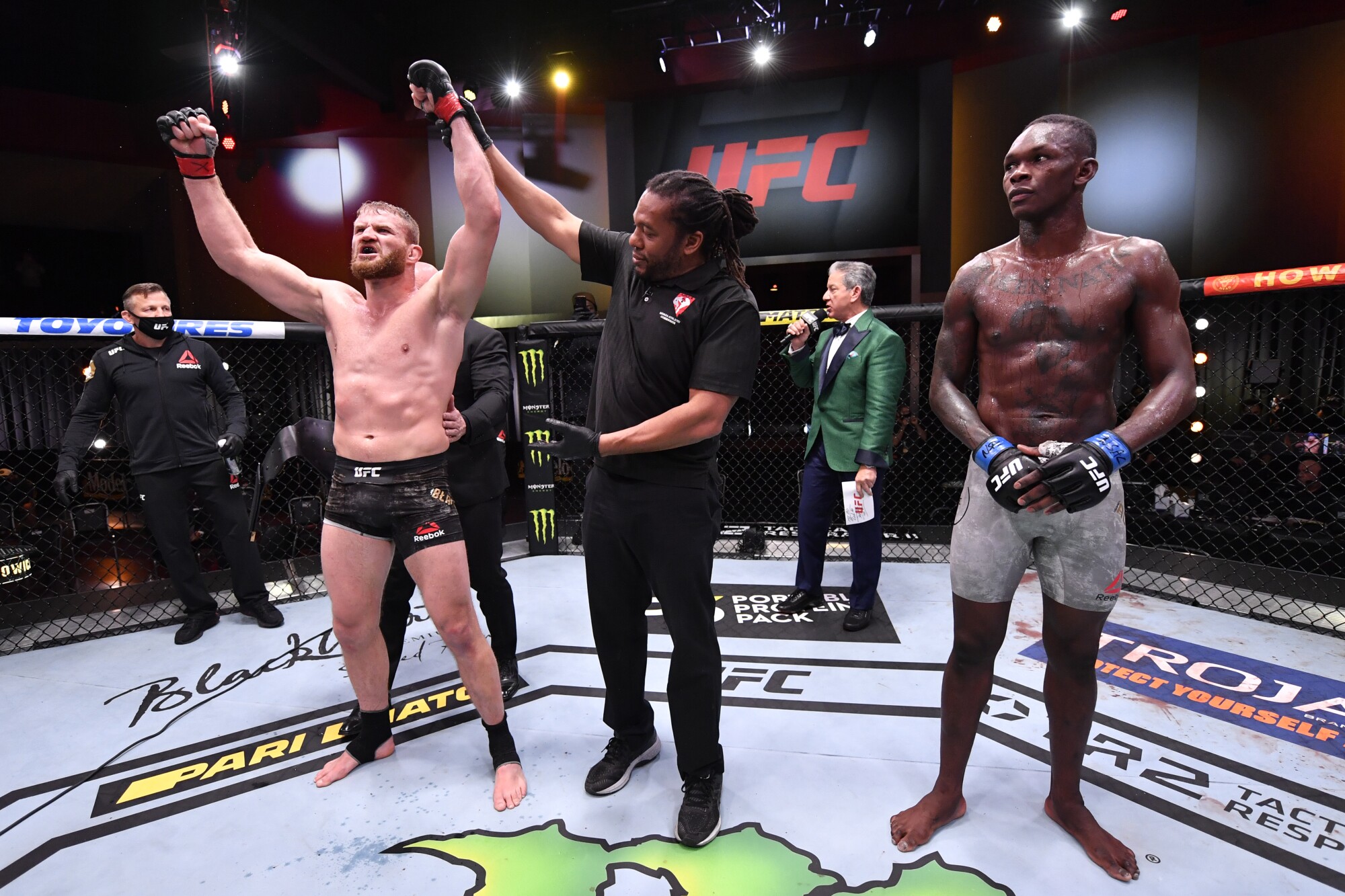 Jan Blachowicz, left, celebrates after his victory over Israel Adesanya.