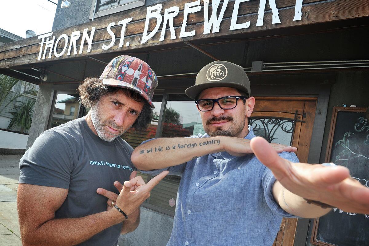 04.27.2017 -- Members of Vokab Kompany, l-r Matthew Burke and Robbie Gallo grab a brew at Thorn Street Brewery. (Rick Nocon/ For The San Diego Union-Tribune)