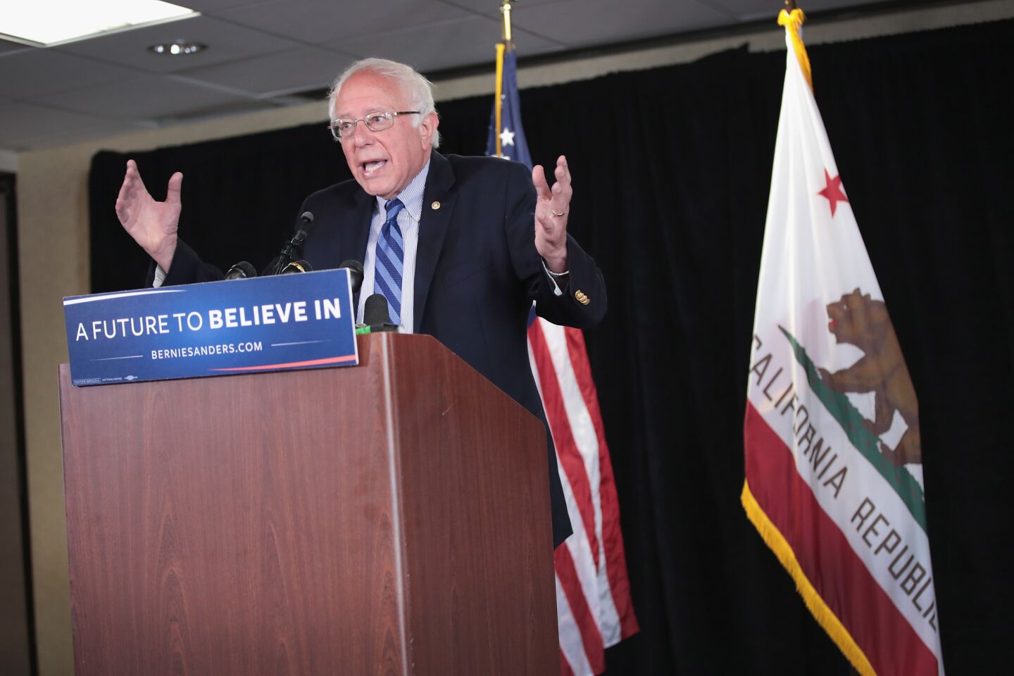 Bernie Sanders speaks to reporters in the Bay Area city of Emeryville.