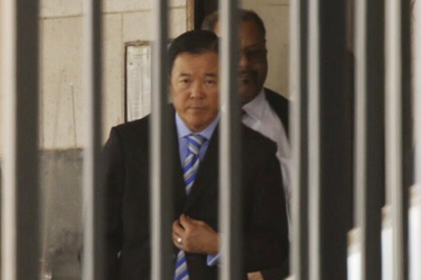 Paul Tanaka leaves court after being sentenced Monday to five years in prison.