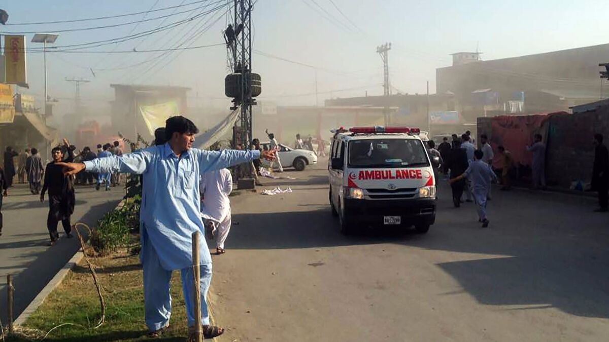 An ambulance transports victims after a twin blasts at a market in the Pakistani city of Parachinar on June 23.