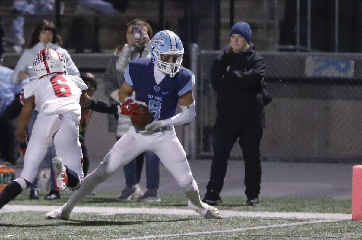 Corona del Mar's Russell Weir (8) turns to the end zone for a touchdown against Chino Hills Ayala on Thursday night.