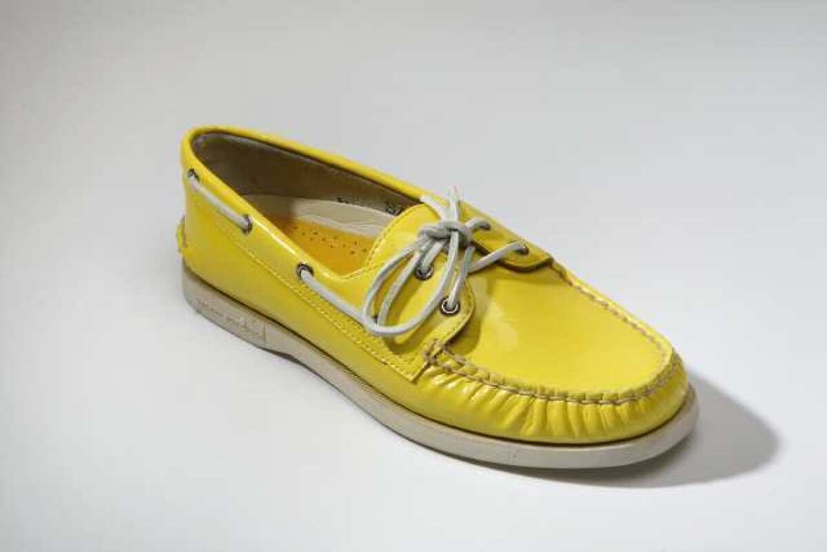 A yellow Sperry Top-Sider shoe. Parent company Collective is being split in two in a $2 billion acquisition.