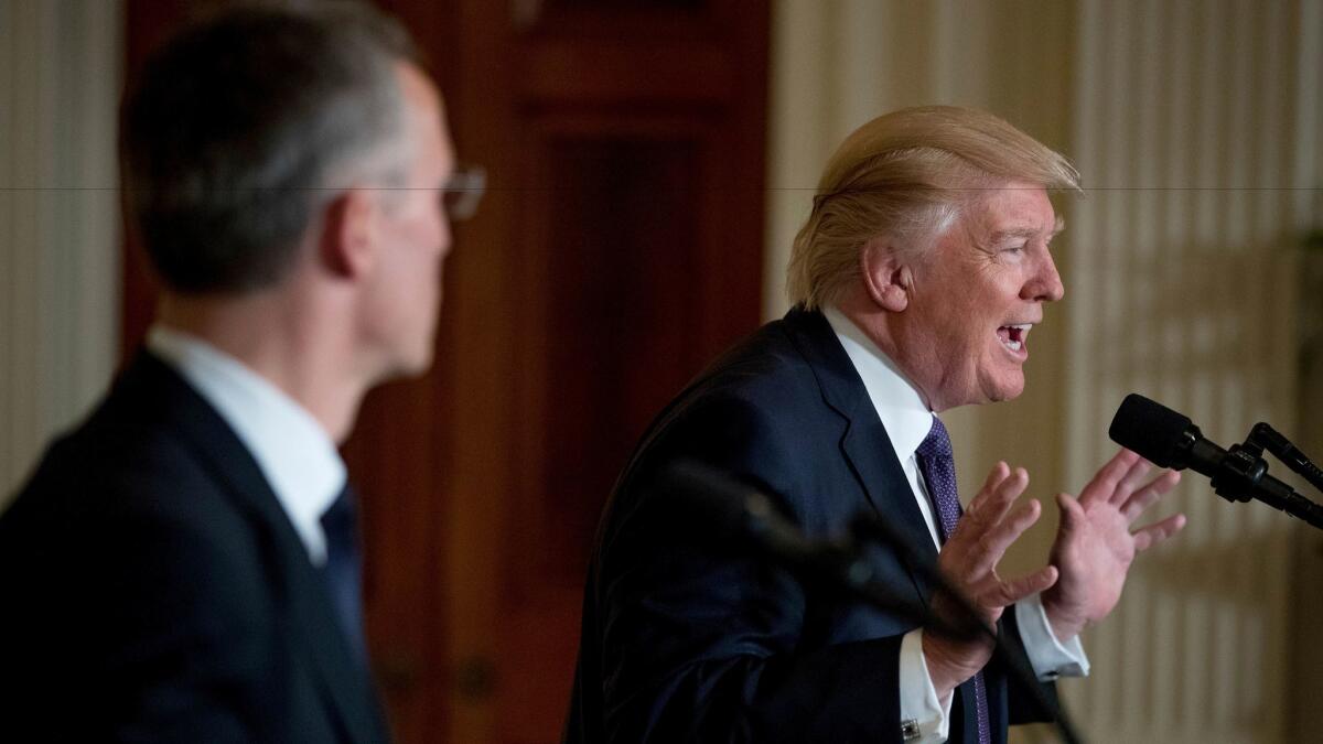 President Trump, accompanied by NATO Secretary General Jens Stoltenberg, speaks at a news conference in the East Room at the White House in Washington on April 12, 2017,