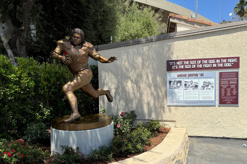 A statue of two-time Heisman Trophy winner Archie Griffin now stands outside the Rose Bowl.