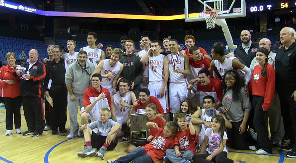 Mater Dei players, coaches, fans and family members celebrate the team's Southern California Regional Open Division title victory over Westchester at Citizens Business Bank Arena in Ontario on Saturday.