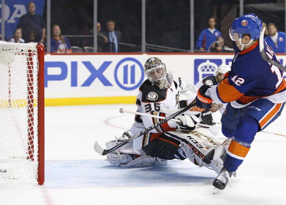 Ducks goalie John Gibson looks over his shoulder as a shot by New York Islanders right wing Josh Bailey slides in for a goal in overtime on Oct. 16.