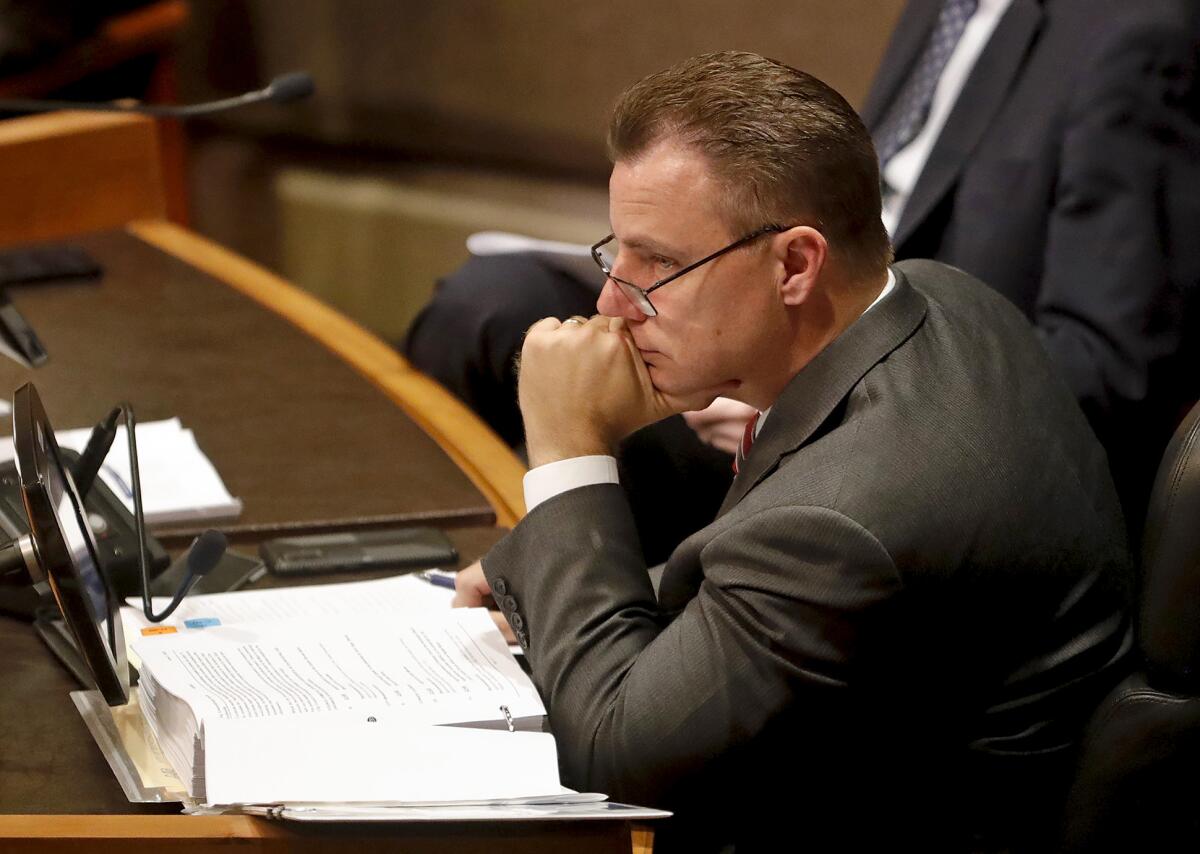 City Atty. Michael Gates listens to public comments during a Huntington Beach City Council meeting on June 7.