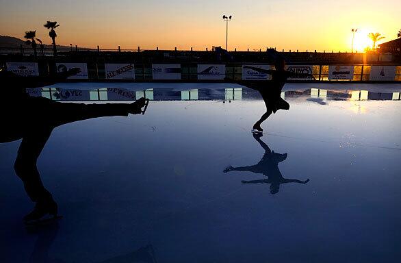 Skaters kick off the opening of the new outdoor rink in Redondo Beach Tuesday.
