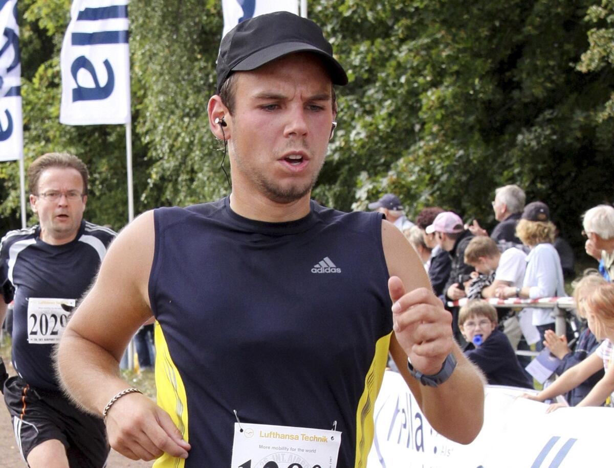 This Sept. 13, 2009 file photo shows Germanwings copilot Andreas Lubitz competing at the Airportrun in Hamburg, Germany.