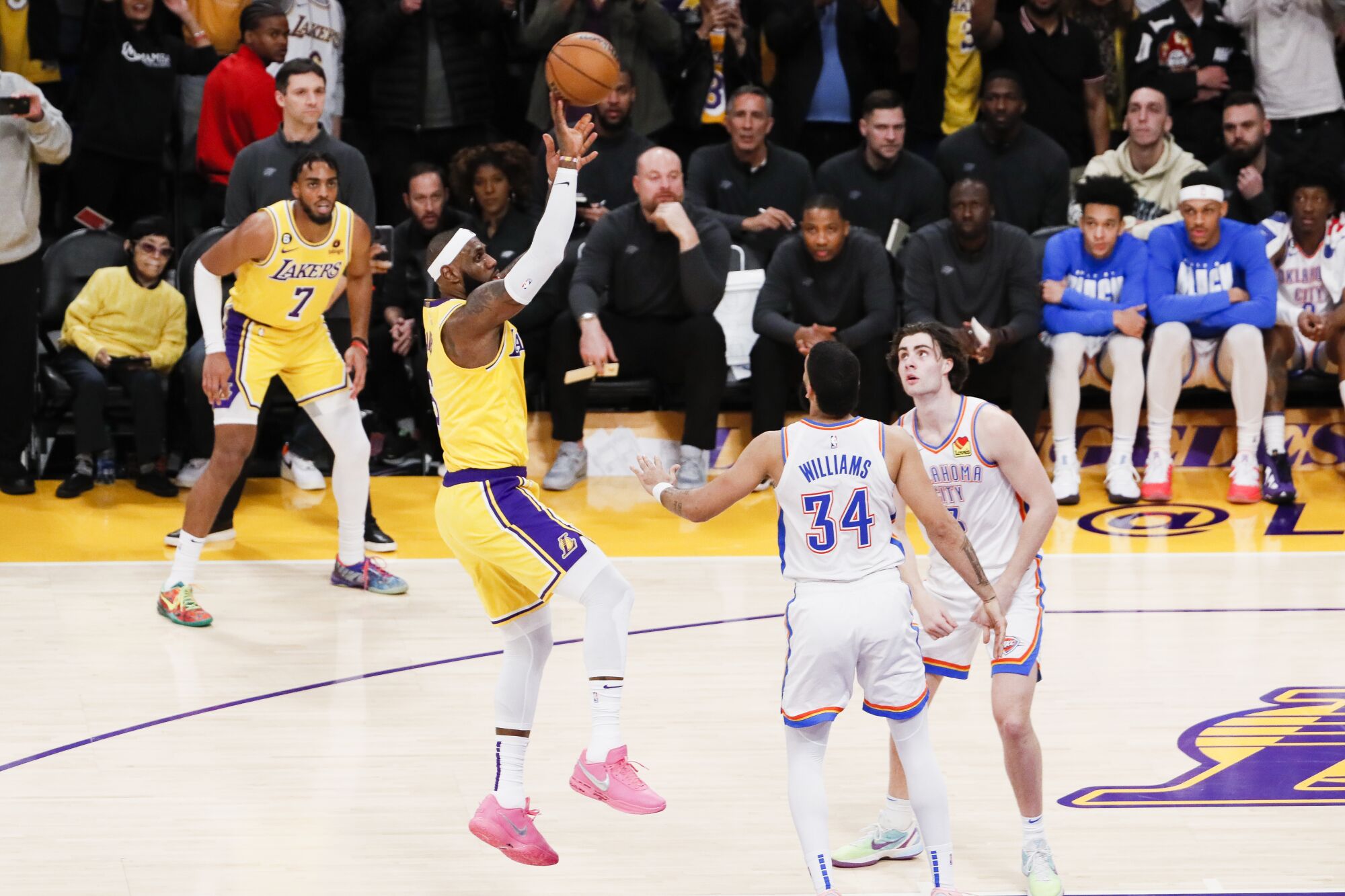 Lakers forward LeBron James releases the shot over Thunder forward Kenrich Williams that gave him the all-time score record.