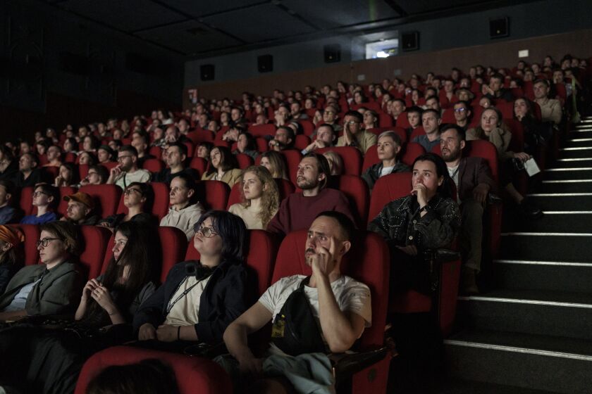 People watch the documentary film "20 Days in Mariupol" during the Ukrainian premiere in Kyiv, Ukraine, Saturday, June 3, 2023. (AP Photo/Roman Hrytsyna)