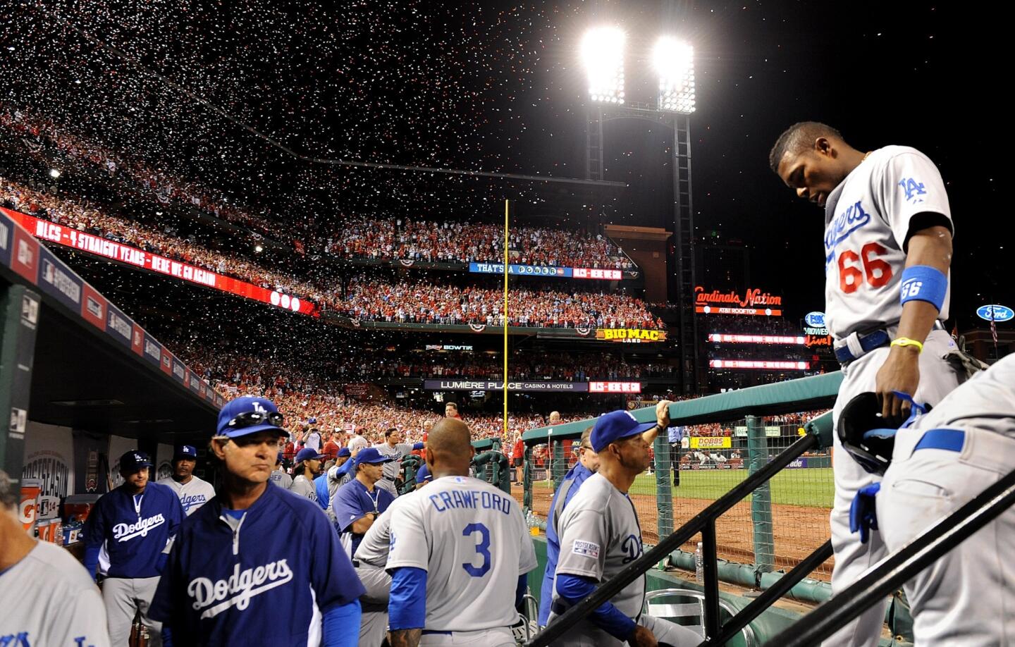 Yasiel Puig walks into the dugout after the Dodgers were eliminated from the postseason Tuesday by the St. Louis Cardinals in Game 4 of the National League Division Series.