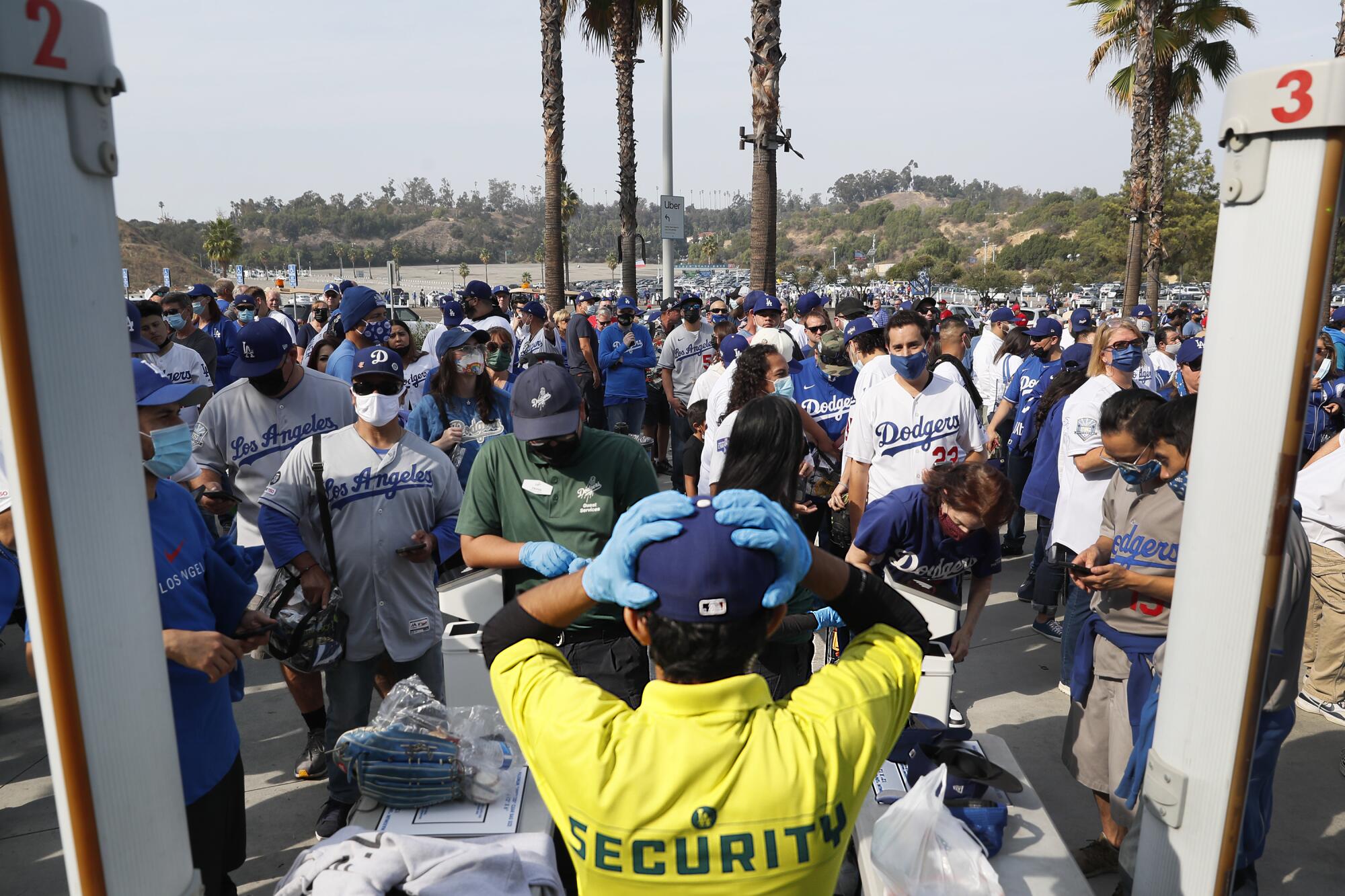Fans gather outside the left field gate hours before the game between the Los Angeles Dodgers and the St. Louis Cardinals