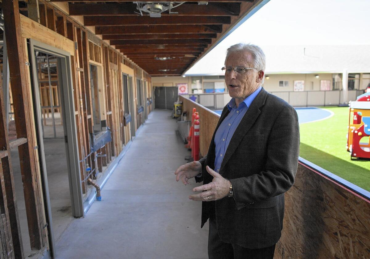 The Rev. Mike Gibson shows how Christ Lutheran Church and School in Costa Mesa is renovating former offices into new preschool classrooms. The work is part of the church's multiyear, $5.4-million renovation project that is expected to be finished in April.