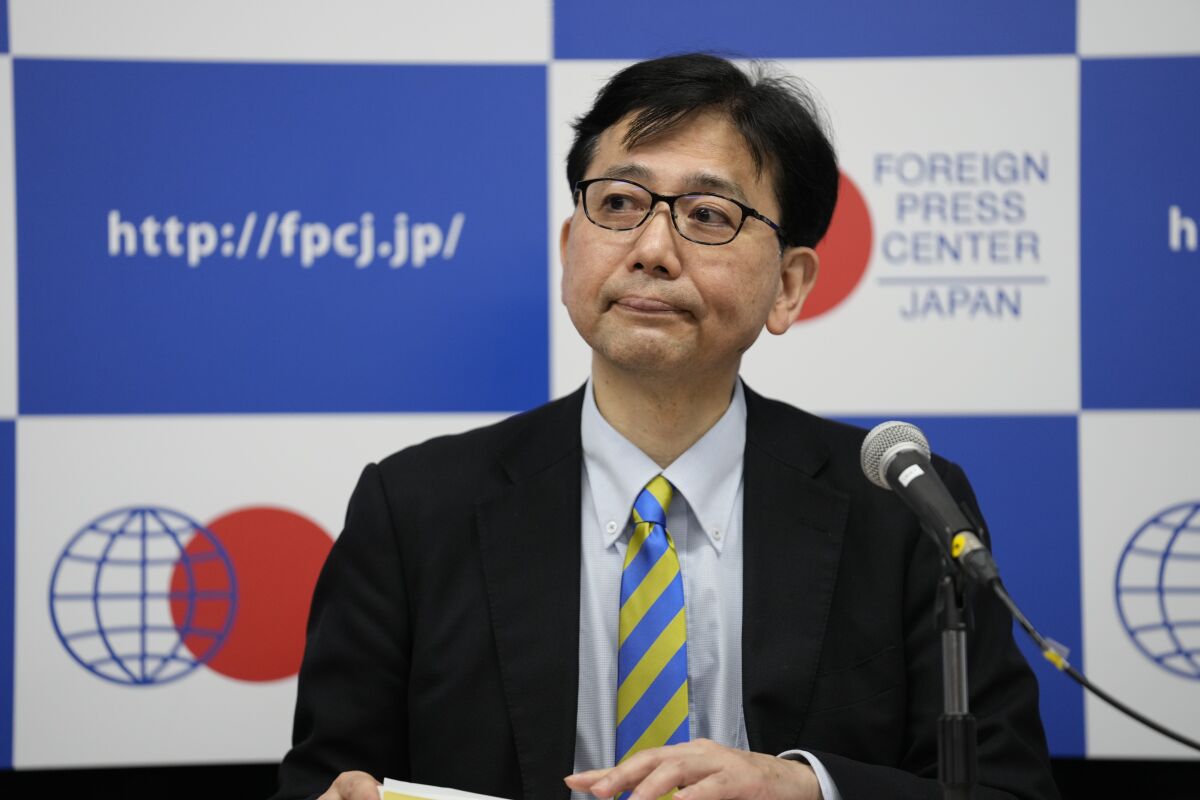 Noriyuki Shikata, cabinet secretary for public affairs of Kishida's government, gets introduced before he speaks in a news briefing in Tokyo, Friday, May 20, 2022. Japan welcomes the Indo-Pacific Economic Framework (IPEF), a new U.S. economic initiative for the Indo-Pacific region that President Biden is expected to roll out during his Tokyo visit next week. Shikata said IPEF is expected to focus more about supply chains, clean energy, worker standards and anti-corruption programs rather than issues in traditional trade agreements such as market access and tariffs. (AP Photo/Hiro Komae)