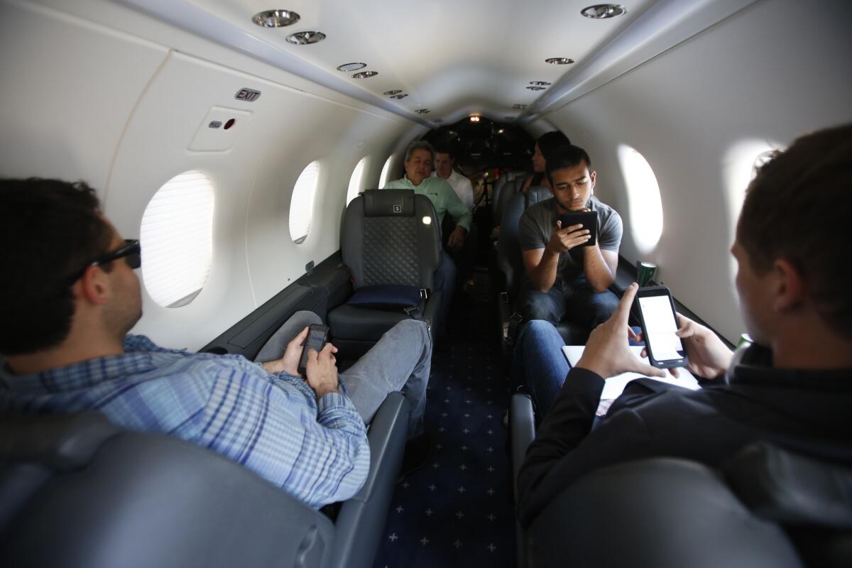 Passengers fly on a SurfAir flight to San Carlos from the Hawthorne Airport in Hawthorne on March 19.