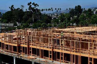 Constuction workers work on site of a new building in Los Angeles, California on October 8, 2019. - California Governor Gavin Newsom will sign into law California's "anti-rent gouging" bill capping rent increases to prevent price-gouging and landlord evictions amid California's rising homeless crisis but critics say the rent caps do not solve the long-term shortage of affordable housing. (Photo by Frederic J. BROWN / AFP) (Photo by FREDERIC J. BROWN/AFP via Getty Images) ** OUTS - ELSENT, FPG, CM - OUTS * NM, PH, VA if sourced by CT, LA or MoD **