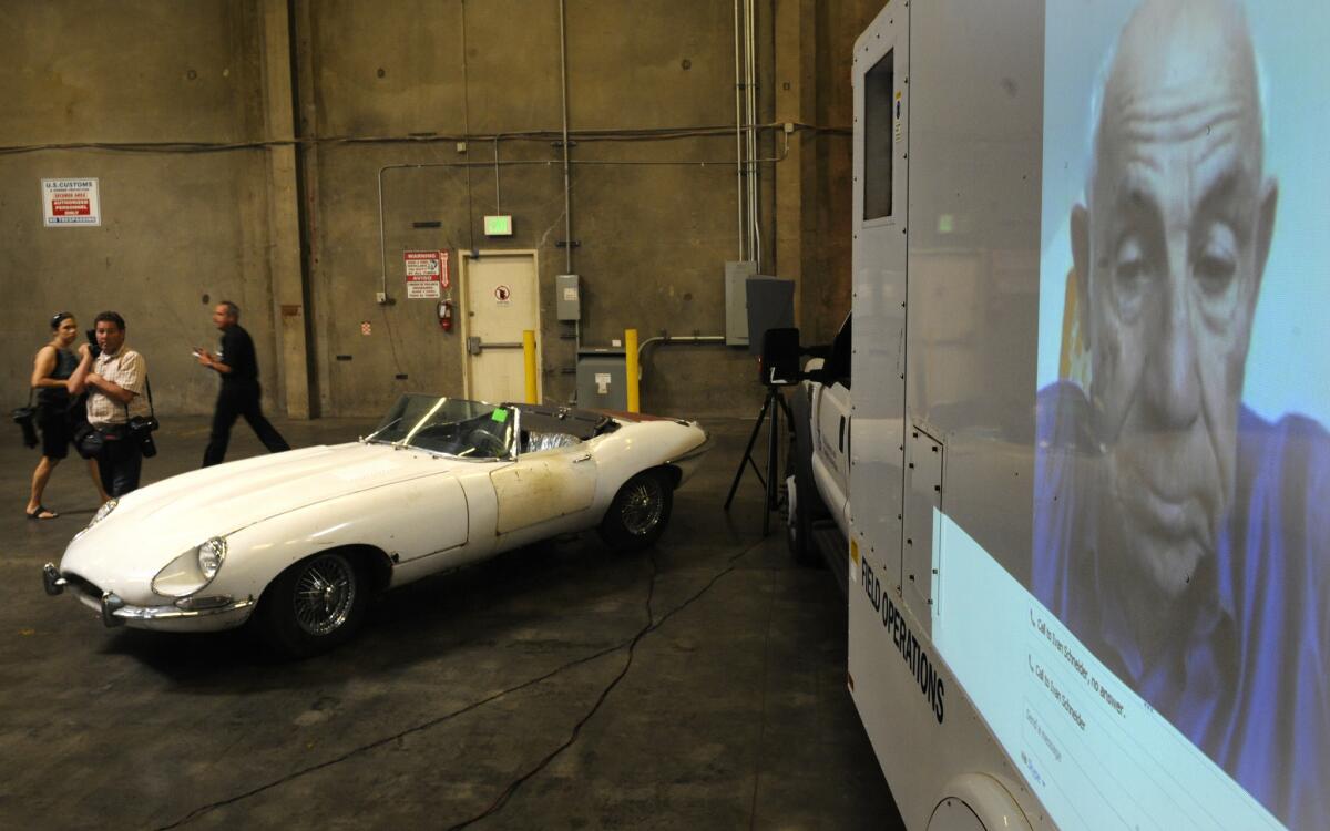 Car owner Ivan Schneider, 82, does a live interview from Florida as his car that was stolen 46 years ago in New York sits in a warehouse after law enforcement officials recently recovered it at the Port of Los Angeles.