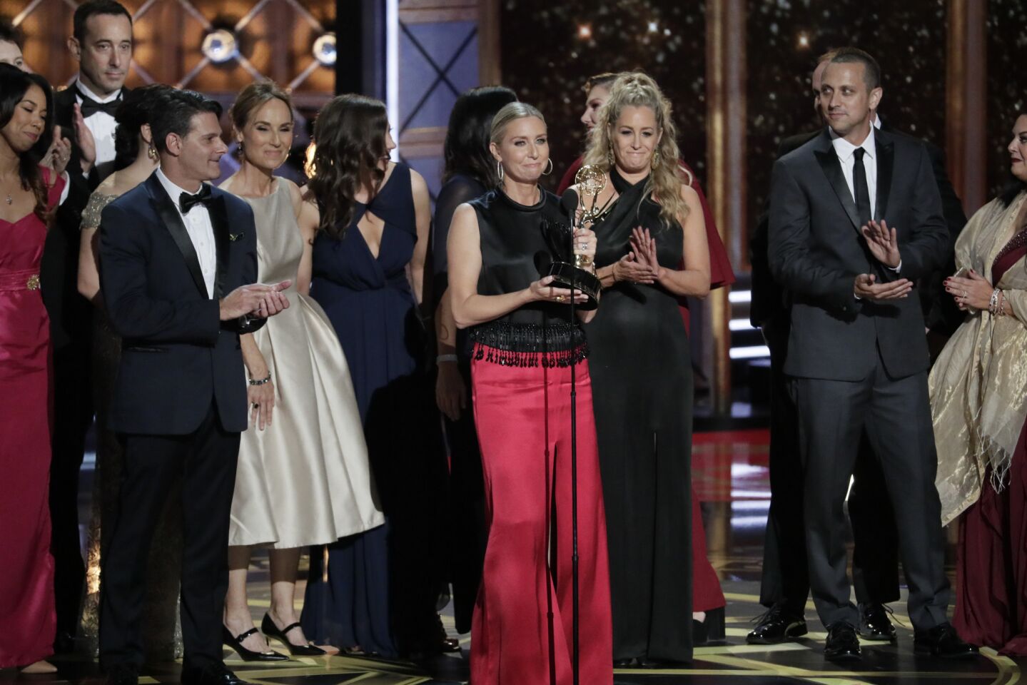 The cast and crew of "The Voice" wins the Emmy for reality competition program.