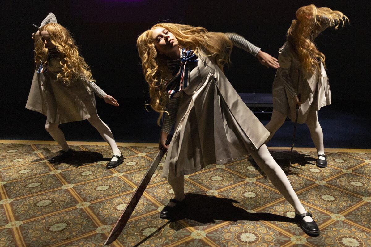 A trio of M3GAN dancers performing.