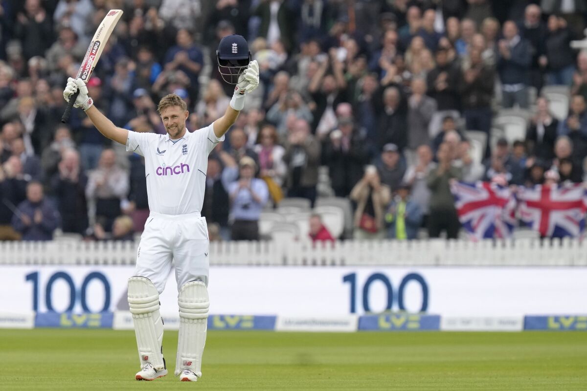 England's Joe Root celebrates scoring his century (100 runs) during the fourth day of the test match between England and New Zealand at Lord's cricket ground in London, Sunday, June 5, 2022. (AP Photo/Kirsty Wigglesworth)