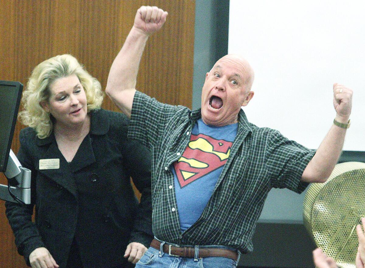 Steve Pierce, of Montrose, shows off his super prowess as Dr. Cynthia Livingston looks on during the annual Smart-a-Thon at USC Verdugo Hills Hospital in Glendale on Wednesday, March 16, 2016.