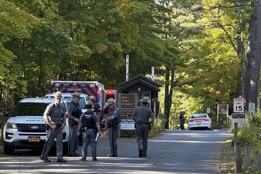 FILE - Police secure the entrance to Moreau Lake State Park as search continues for Charlotte Sene, a missing 9-year-old girl who had been camping over the weekend with her family at the park, Monday Oct. 2, 2023, in New York. (AP Photo/Michael Hill, File)