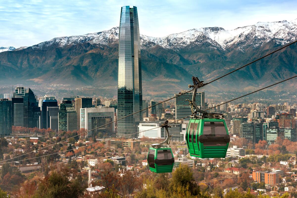 Cable cars rise above Santiago de Chile.