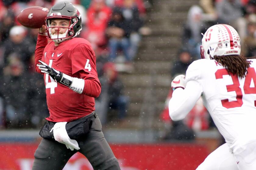 Washington State quarterback Luke Falk (4) throws a pass as he is chased by Stanford linebacker Peter Kalambayi (34) during the first half of an NCAA college football game in Pullman, Wash., Saturday, Nov. 4, 2017. (AP Photo/Young Kwak)