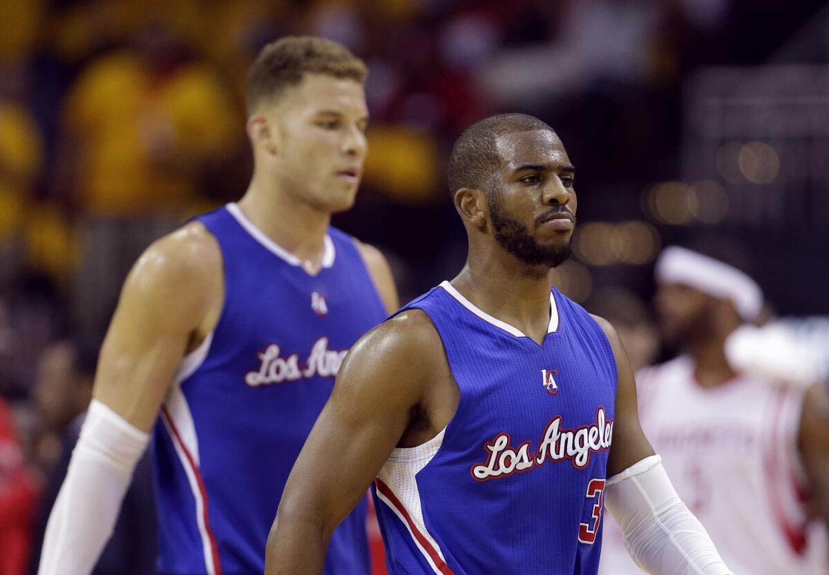 Blake Griffin and Chris Paul walk off the court during a timeout in Game 5 of the Clippers' second round playoff series against the Houston Rockets.