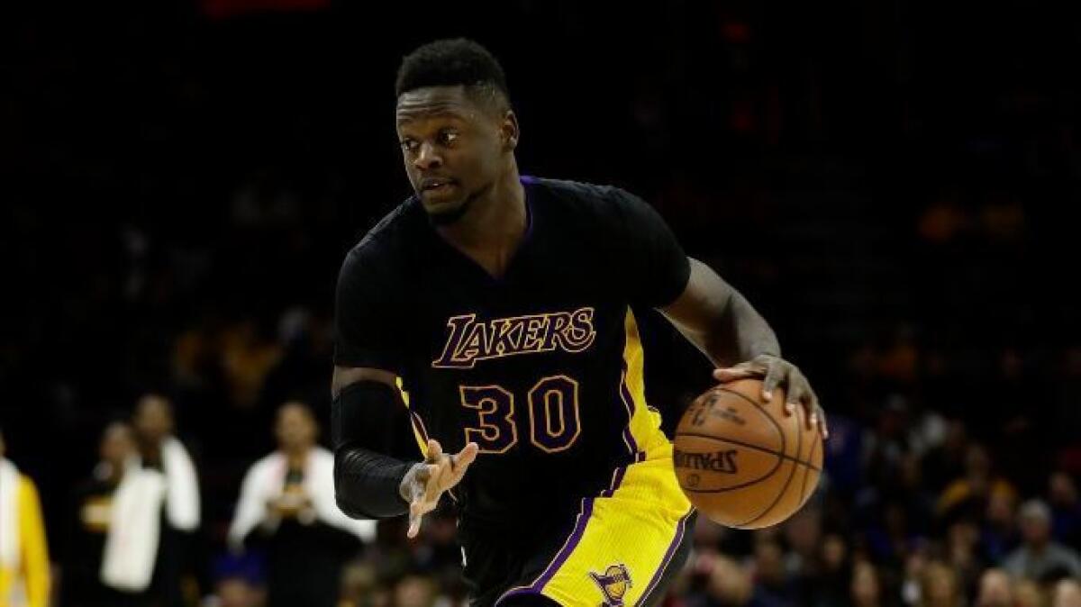 Lakers forward Julius Randle advances the ball during a game against the Philadelphia 76ers on Dec. 16.