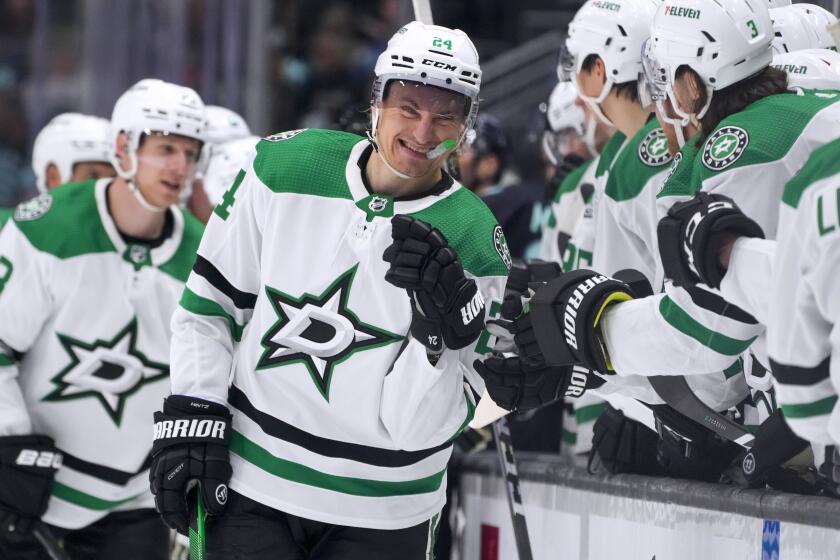 FILE - Dallas Stars center Roope Hintz is congratulated for a goal against the Seattle Kraken during the third period of an NHL hockey game Saturday, March 30, 2024, in Seattle. The Stars are heading toward the NHL playoffs with the league's most balanced scoring team. (AP Photo/Lindsey Wasson, File)