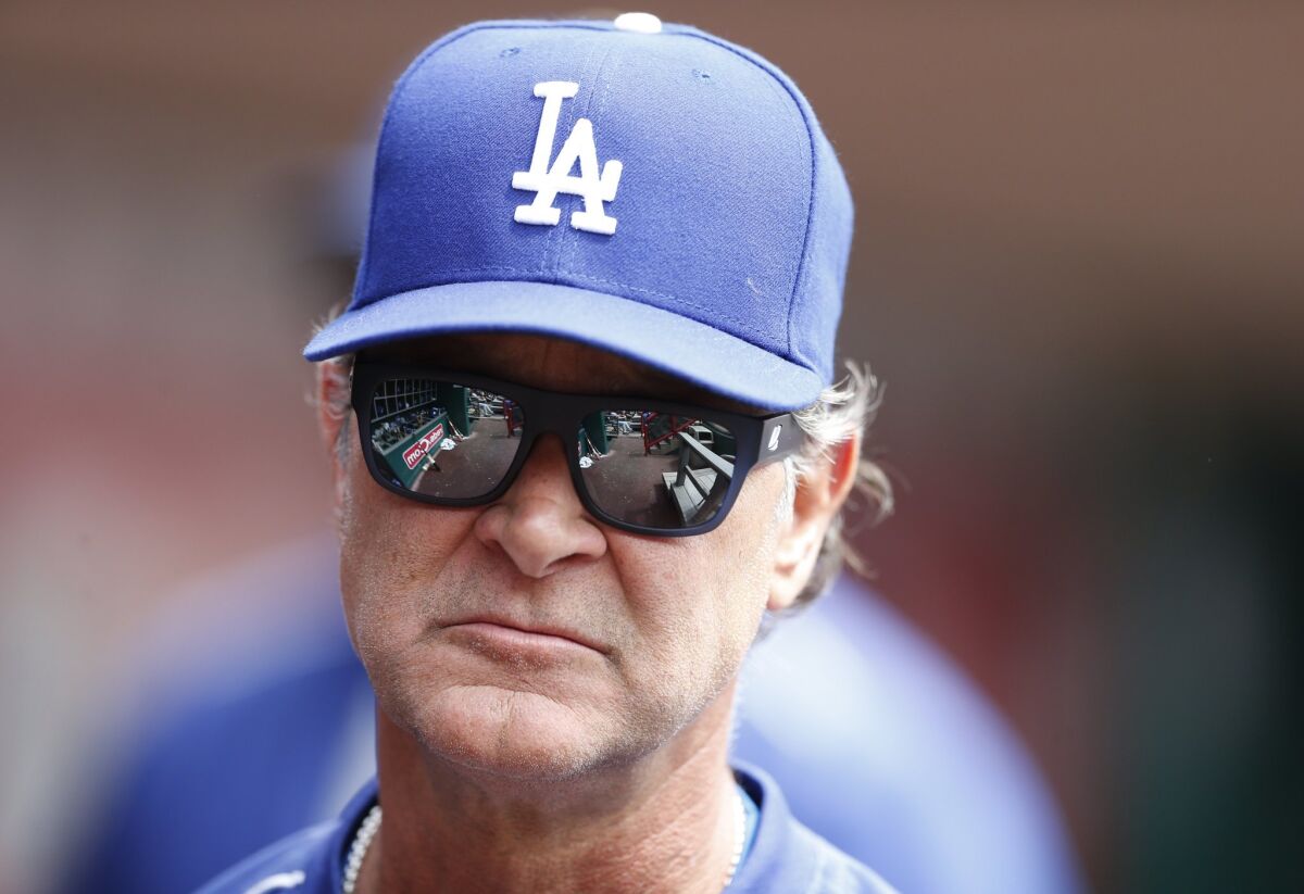 Don Mattingly watches the Dodgers play the Reds in Cincinnati on Aug. 27.