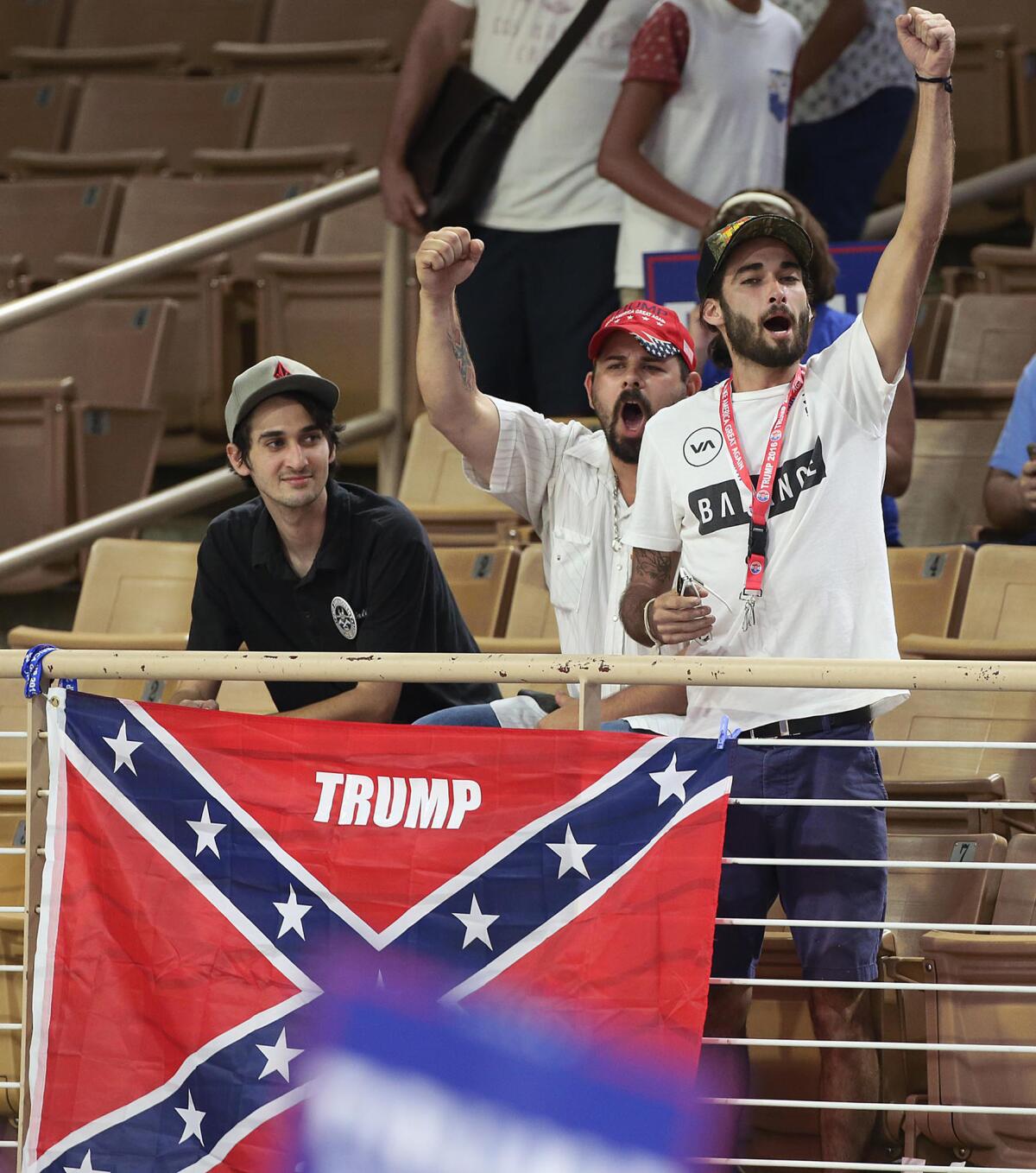 Supporters of Donald Trump caused a stir at a rally in Florida on Aug. 11 after they were asked to remove their Confederate flag.