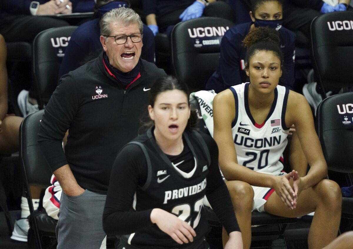 Connecticut head coach Geno Auriemma shouts from the sideline during the first half of an NCAA college basketball game against Providence at Harry A. Gampel Pavilion, Saturday, Jan. 9, 2021, in Storrs, Conn. (David Butler II/Pool Photo via AP)